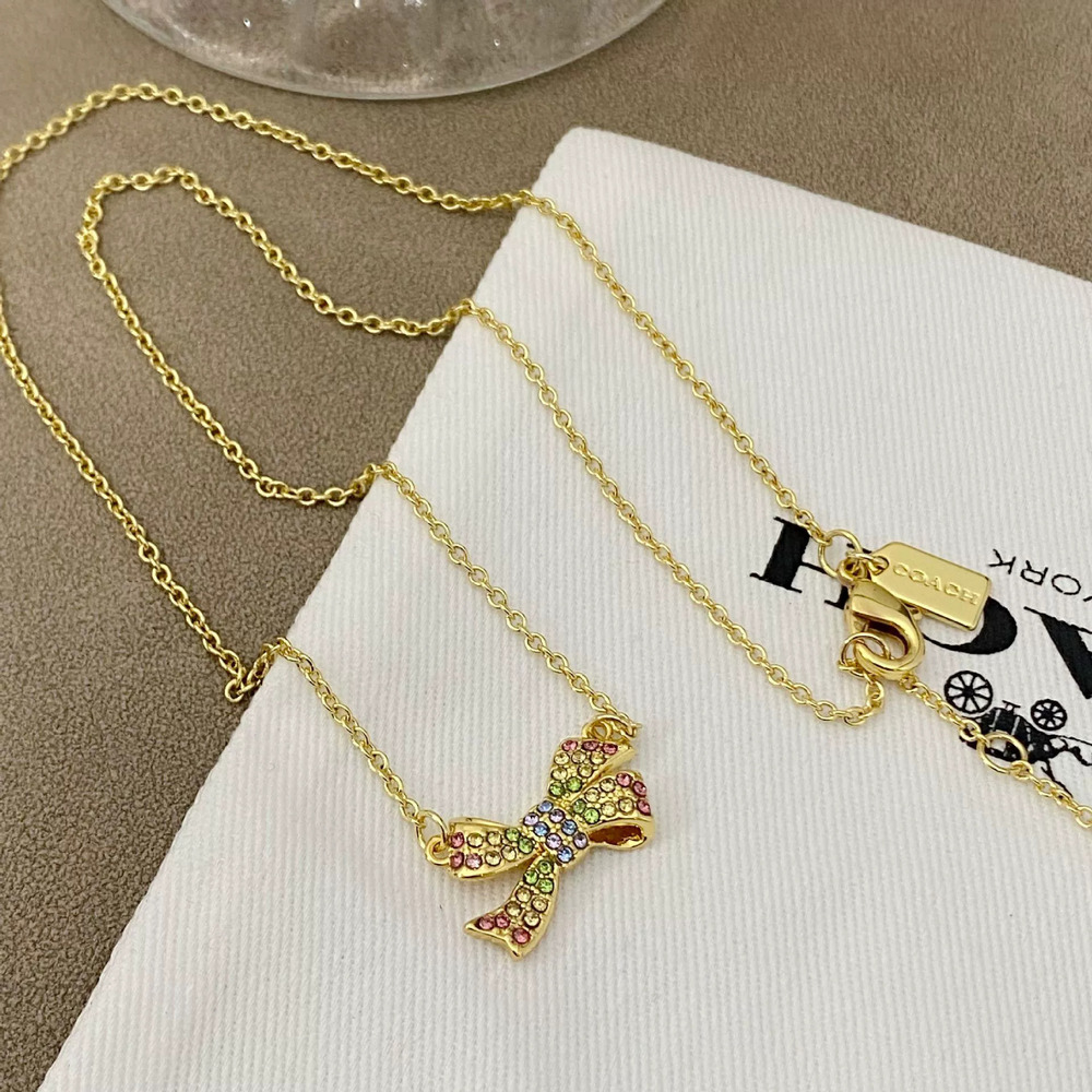Coach Metal Colorful Rhinestone Bow Necklace - Picture 2 of 6